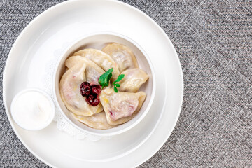 Cherry Vareniki Served with Sour Cream