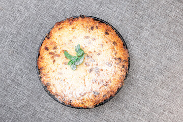 Traditional Russian Cottage Cheese Casserole with Raisins, in a Cast Iron Skillet. View from the top
