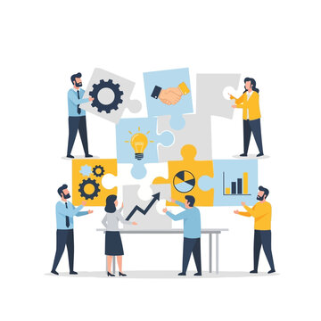 Teamwork and Strategy: People assembling puzzle pieces with business graphics