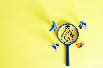 Startup business launch and global expansion. Miniature people looking at rocket ship icon. Concept of new project, innovation, and international market on yellow background.