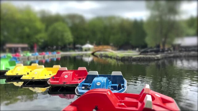 Colorful Pedal Boats on a Serene Lake in 4K During