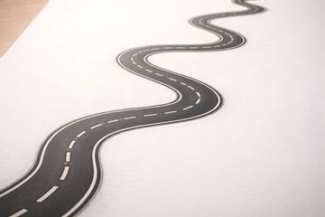 Winding Path: An image of a winding road illustrates the twists and turns of a journey, guiding the viewer toward an unknown destination.