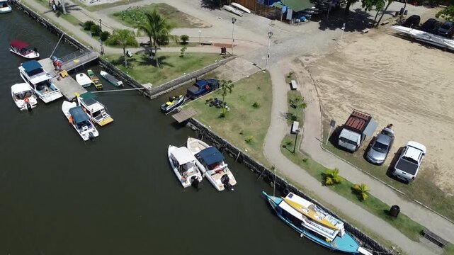Small leisure crafts moored and launched from a ramp along the river Rio Pereque Acu in Baia de Paraty in Brazil