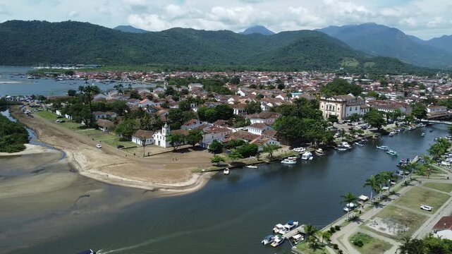 Circling aerial view of Paraty, with the mountains and the Atlantic forest that surrounds this Idyllic city