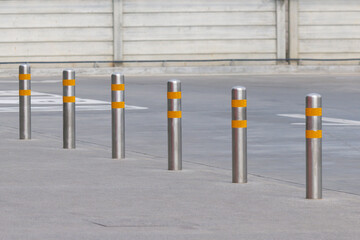 Naklejka premium stainless steel bollards on pathway.