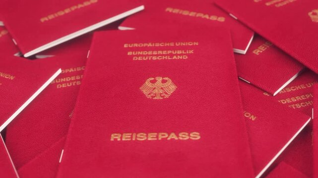 Pile of German Passports With Close-Up Focus on Central Document