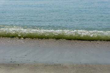 Sand and sea with waves on the beach