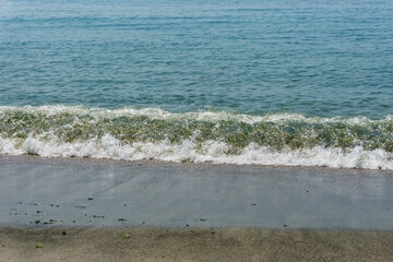Sand and sea with waves on the beach