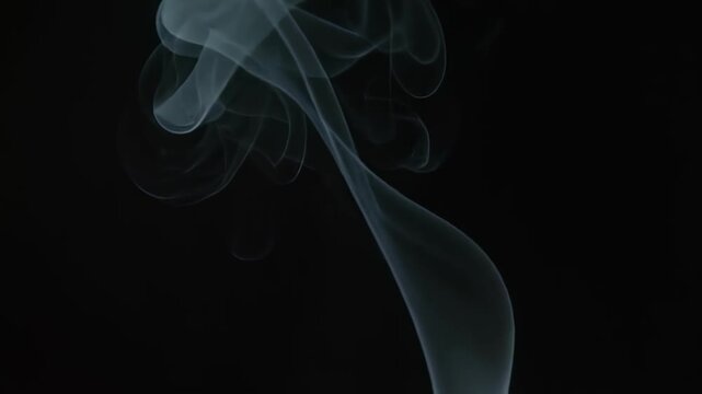 Ethereal smoke swirling in darkness with mysterious movement