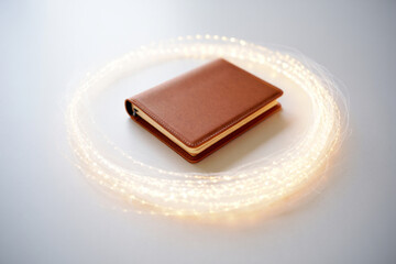 Brown leather journal or diary with string lights, for mockup or overlay effect, isolated on transparent background, png