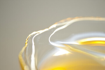 Golden liquid with light reflection, glossy surface, for mockup or overlay effect
