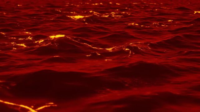 Crimson Waves with Yellow Lights Reflecting on Turbulent Red Water Surface