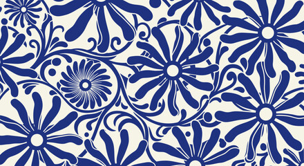 A close-up view of a repeating pattern of blue flowers with swirling green vines on a white background. © Abdul