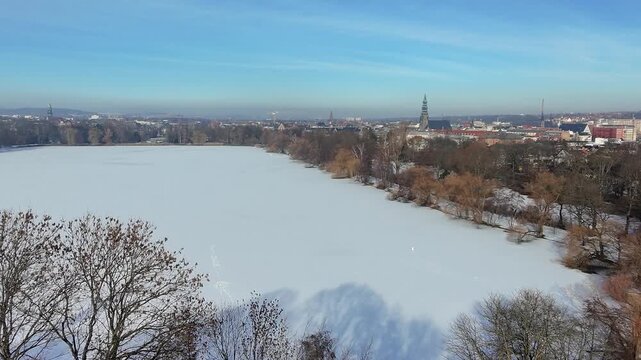 Zwickau Swan Pond frozen from above in winter landscape 4k