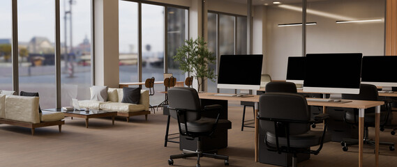 Fototapeta premium 3D Modern open office workspace with blank computer, desks, chairs, and natural light in a clean corporate interior