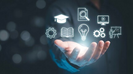 Fototapeta premium A person's hand illuminates a comprehensive array of glowing digital icons representing education knowledge innovation learning and business management solutions against a dark background.