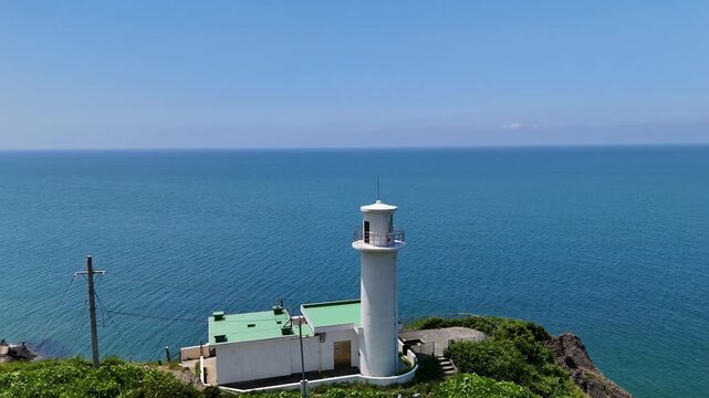 Aerial View of Kakudahama Lighthouse Over the Blue Summer Sea.