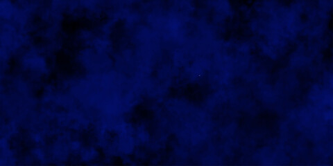 
Artificial magic smoke in black and blue light on black background in darkness. light blue and dark blue background. Black and blue Grunge Concrete Wall Texture Background.

