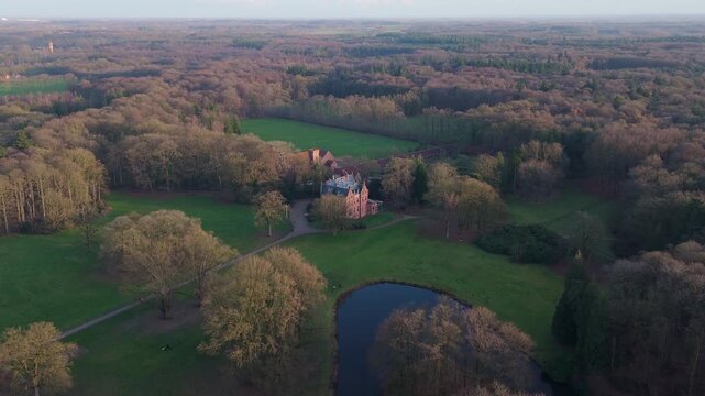 Drone Fly Forward Toward Castle Over Green Fields in Bulskampveld Forest, Belgium | FlyLens