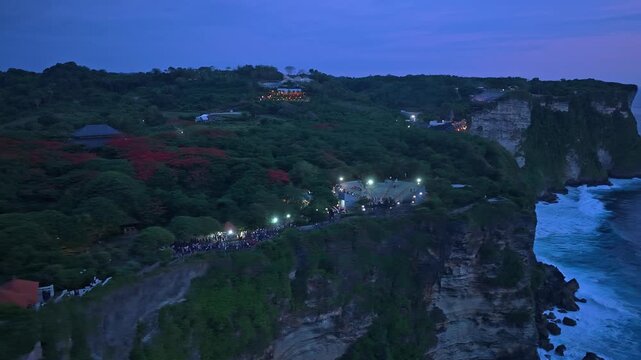 Aerial view of uluwatu temple kecak dance performance at sunset