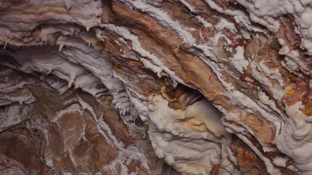 The walls of the salt cave on Qeshm Island with textured mineral walls and crystalline. Unique geological landscape and underground travel destination. one of the seven wonders of the Persian Gulf.