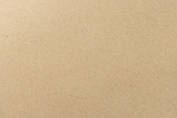 Fototapeta premium Top view of brown kraft paper texture background,A high-resolution, close-up shot of a natural brown recycled kraft paper texture with fine organic fibers and subtle speckles, perfect for eco-friendly