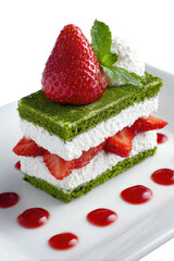 Elegant layered green cake with fresh strawberries, cream, mint, and strawberry coulis