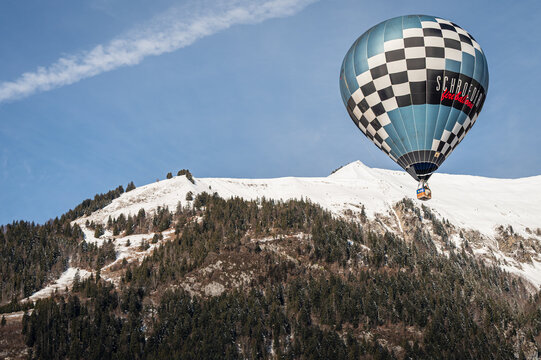 Chateau d'oex, Vaud Canton, Switzerland - 1st February 2026: schroeder fire balloon Flight Over sky in Switzerland Winter.