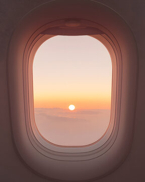 Minimalist view through an airplane window at sunset