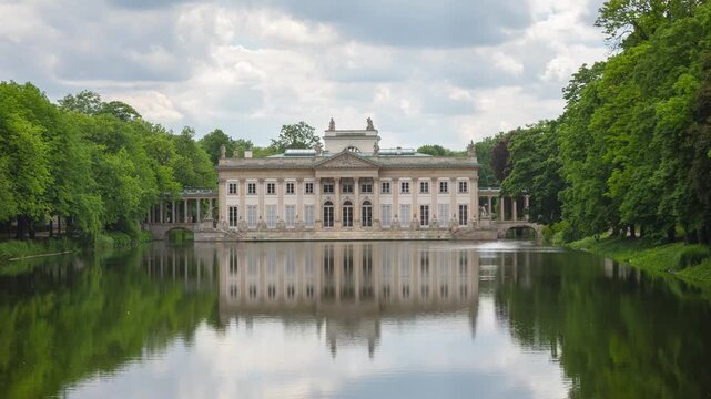Warsaw, Poland. Palace on the Isle (Palac na Wyspie) reflecting in pond in Royal Baths park. Time lapse video