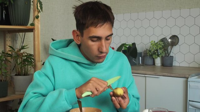 a man has dinner at home after work
