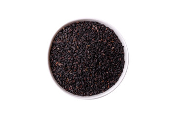 Black sesame seeds in a bowl, an ingredient for oil and healthy eating. Black sesame