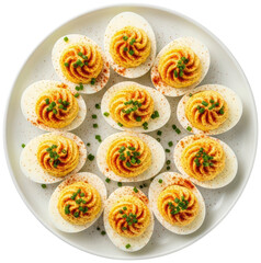 Deviled eggs with paprika and chives on white plate