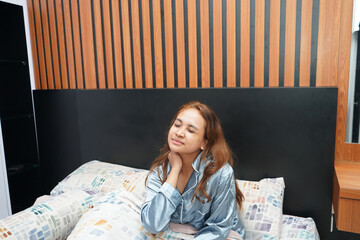 Young Woman Waking Up with Neck Pain or Stiffness