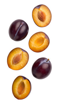 Falling plum fruit halves and whole isolated on transparent background