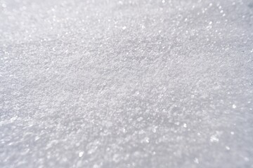 Obraz premium High-resolution detail of a hard-packed snow surface sparkling in bright sunshine in the Tyrolean Alps, crisp winter alpine textures with clear light and shadows.