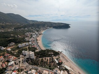 Aerial panorama of Albanian coastline with beaches and blue sea, highlighting coastal geography, tourism potential, and Balkan seaside landscape