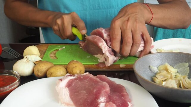 a man cooks dinner after work