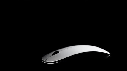 A white wireless computer mouse on a black background. Concept White wireless computer mouse, Black background studio shot, Minimalist tech product photography, Close-up product shot