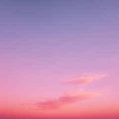 Beautiful sunset sky with pink and purple gradient and soft clouds