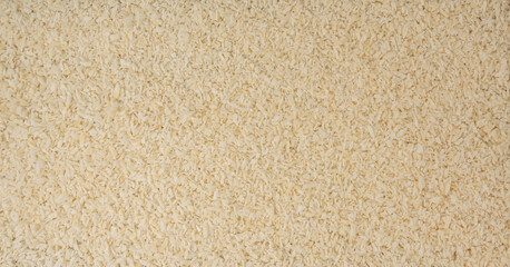 Grated coconut powder. Dry coco flakes pile, shredded desiccated coconut, tropical fruit chips