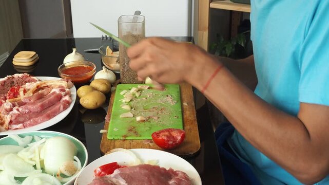 a man cooks dinner after work