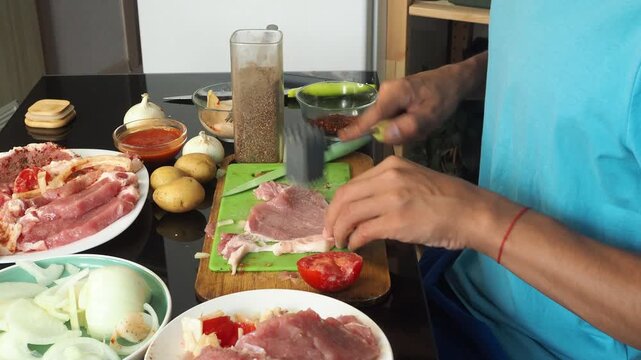 a man cooks dinner after work