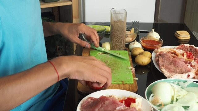 a man cooks dinner after work