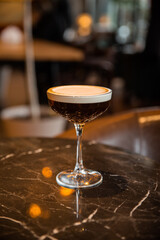 glass of coffee cocktail  on a table