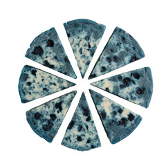 Blueberry cheesecake sliced into eight even portions on a stark black backdrop