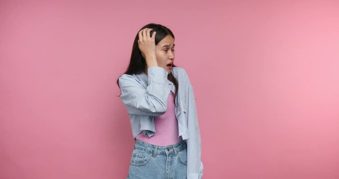 Young woman shows different reactions in a colorful setting while interacting with the camera