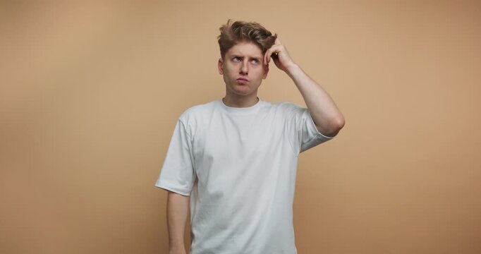 Person shows different gestures indicating confusion, thought, and realization while standing against a plain background