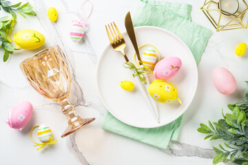 Easter table setting on white background.
