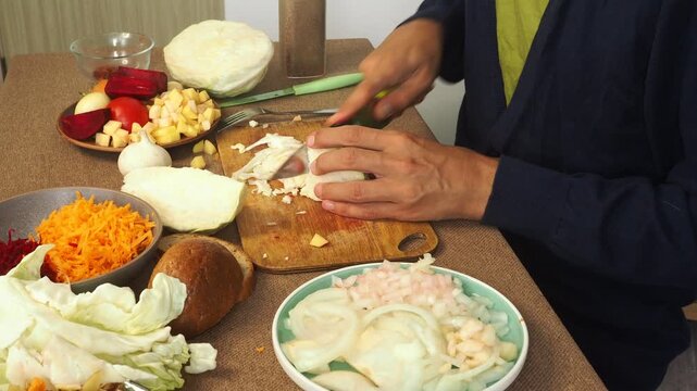 a man making egg sandwiches for breakfast